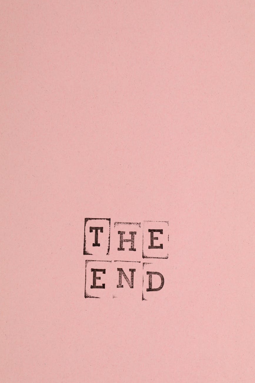 A simple pink background featuring the stamped words 'The End'.